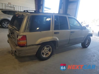 Trzecie zdjęcie samochodu z tyłu: 1997 JEEP GRAND CHEROKEE LAREDO VIN:1J4FX58S0VC770823 - miniatura