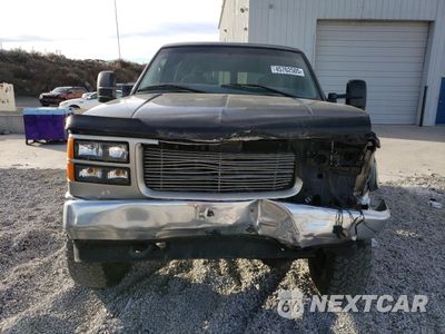 Piąte zdjęcie samochodu w środku: 1999 GMC SUBURBAN K1500 VIN:1GDFK16R6XJ778691 - miniatura