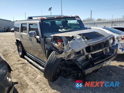 Czwarte zdjęcie samochodu z boku: 2005 HUMMER H2 VIN:5GRGN23U45H178439 - miniatura
