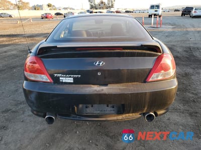 Zdjęcie 6 z 12 samochodu: 2005 HYUNDAI TIBURON VIN:KMHHM65D25U176369 - miniatura