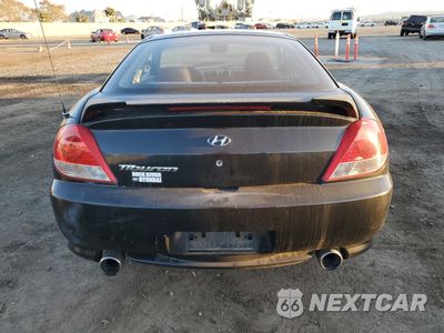 Zdjęcie 6 z 12 samochodu: 2005 HYUNDAI TIBURON VIN:KMHHM65D25U176369 - miniatura