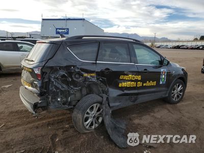 Trzecie zdjęcie samochodu z tyłu: 2018 FORD ESCAPE SE VIN:1FMCU9GDXJUD21466 - miniatura