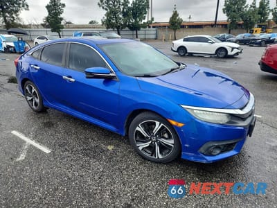 Czwarte zdjęcie samochodu z boku: 2016 HONDA CIVIC TOURING VIN:2HGFC1F93GH643205 - miniatura