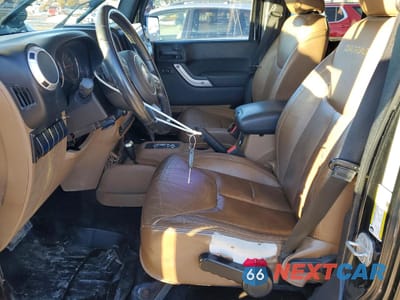 Zdjęcie 7 z 12 samochodu: 2013 JEEP WRANGLER UNLIMITED SAHARA VIN:1C4HJWEG7DL534853 - miniatura