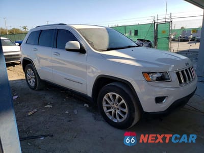 Czwarte zdjęcie samochodu z boku: 2014 JEEP GRAND CHEROKEE LAREDO VIN:1C4RJEAG8EC433097 - miniatura