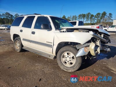 Czwarte zdjęcie samochodu z boku: 2003 CHEVROLET TAHOE C1500 VIN:1GNEC13ZX3J102246 - miniatura