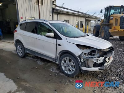 Czwarte zdjęcie samochodu z boku: 2016 FORD ESCAPE TITANIUM VIN:1FMCU9J94GUC42484 - miniatura