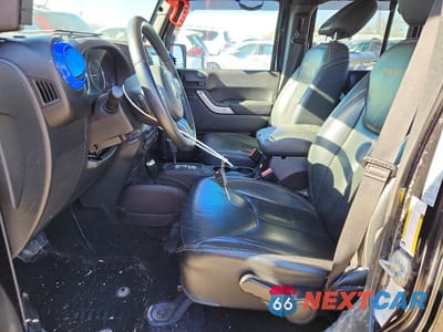 Zdjęcie 7 z 12 samochodu: 2015 JEEP WRANGLER UNLIMITED SAHARA VIN:1C4BJWEG0FL754330 - miniatura