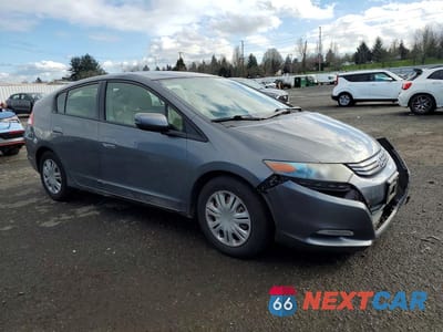 Czwarte zdjęcie samochodu z boku: 2010 HONDA INSIGHT LX VIN:JHMZE2H51AS043450 - miniatura