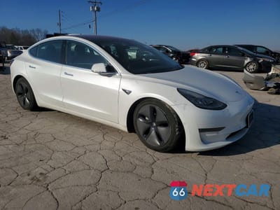 Czwarte zdjęcie samochodu z boku: 2018 TESLA MODEL 3 VIN:5YJ3E1EB3JF178860 - miniatura
