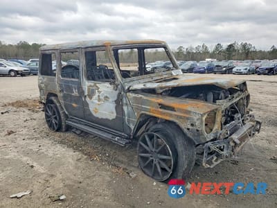 Czwarte zdjęcie samochodu z boku: 2013 MERCEDES-BENZ G 63 AMG VIN:WDCYC7DF1DX210390 - miniatura