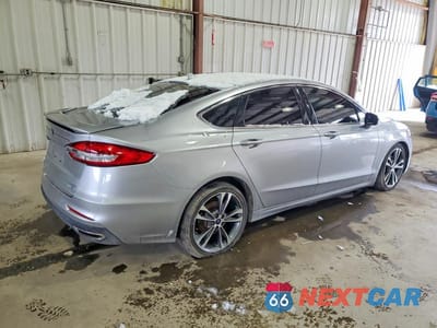 Trzecie zdjęcie samochodu z tyłu: 2020 FORD FUSION TITANIUM VIN:3FA6P0D96LR115436 - miniatura