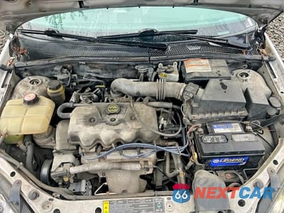 Zdjęcie 12 z 13 samochodu: 2001 FORD FOCUS LX VIN:1FAFP33P71W151227 - miniatura