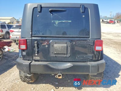 Zdjęcie 6 z 13 samochodu: 2009 JEEP WRANGLER UNLIMITED SAHARA VIN:1J4GA59169L744874 - miniatura