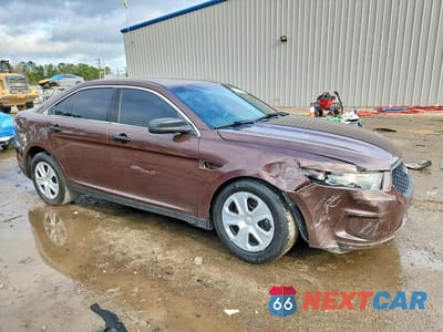 Czwarte zdjęcie samochodu z boku: 2015 FORD TAURUS POLICE INTERCEPTOR VIN:1FAHP2MK5FG194228 - miniatura