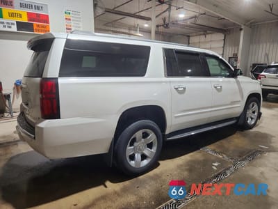 Trzecie zdjęcie samochodu z tyłu: 2017 CHEVROLET SUBURBAN K1500 PREMIER VIN:1GNSKJKC0HR327898 - miniatura
