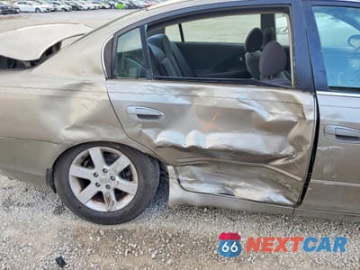 Zdjęcie 10 z 13 samochodu: 2002 NISSAN ALTIMA 2.5 VIN:1N4AL11D82C262343 - miniatura