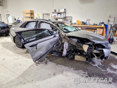Czwarte zdjęcie samochodu z boku: 2015 LINCOLN MKZ HYBRID VIN:3LN6L2LU3FR625363 - miniatura