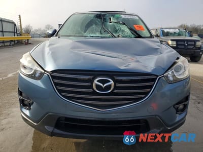 Piąte zdjęcie samochodu w środku: 2016 MAZDA CX-5 TOURING VIN:JM3KE2CYXG0860917 - miniatura
