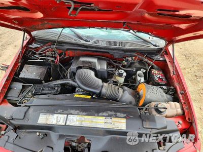 Zdjęcie 11 z 12 samochodu: 2000 FORD F150 VIN:1FTRX08LXYKA05403 - miniatura