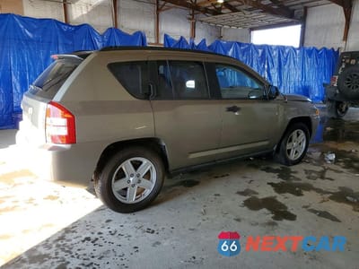 Trzecie zdjęcie samochodu z tyłu: 2010 JEEP COMPASS VIN:1J8FT47W07D204313 - miniatura