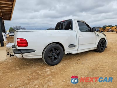 Trzecie zdjęcie samochodu z tyłu: 2000 FORD F150 SVT LIGHTNING VIN:2FTZF0733YCA81697 - miniatura
