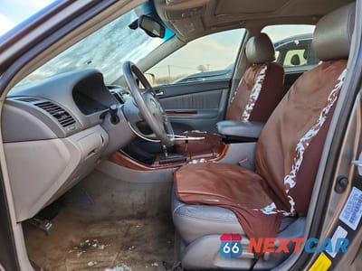 Zdjęcie 7 z 12 samochodu: 2003 TOYOTA CAMRY LE VIN:4T1BE30K73U672322 - miniatura