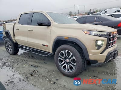 Czwarte zdjęcie samochodu z boku: 2024 GMC CANYON AT4 VIN:1GTP6DEKXR1211891 - miniatura