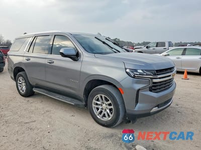Czwarte zdjęcie samochodu z boku: 2021 CHEVROLET TAHOE C1500 LT VIN:1GNSCNKD5MR117028 - miniatura