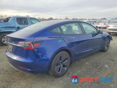 Trzecie zdjęcie samochodu z tyłu: 2023 TESLA MODEL 3 VIN:5YJ3E1EA4PF648541 - miniatura