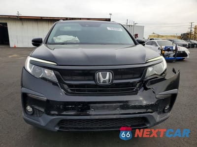 Piąte zdjęcie samochodu w środku: 2021 HONDA PILOT SE VIN:5FNYF5H28MB043660 - miniatura