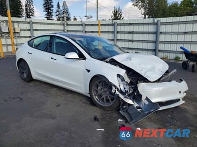 Czwarte zdjęcie samochodu z boku: 2021 TESLA MODEL 3 VIN:5YJ3E1EA9MF854725 - miniatura