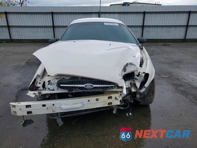 Piąte zdjęcie samochodu w środku: 2000 FORD TAURUS LX VIN:1FAFP5221YA243068 - miniatura