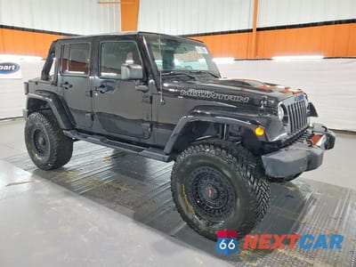 Czwarte zdjęcie samochodu z boku: 2017 JEEP WRANGLER UNLIMITED SAHARA VIN:1C4BJWEG0HL660547 - miniatura