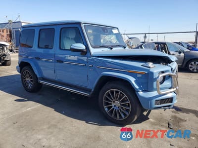 Czwarte zdjęcie samochodu z boku: 2021 MERCEDES-BENZ G 550 VIN:W1NYC6BJ1MX408855 - miniatura
