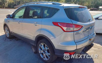 Trzecie zdjęcie samochodu z tyłu: 2016 FORD ESCAPE TITANIUM VIN:1FMCU9JXXGUC33190 - miniatura