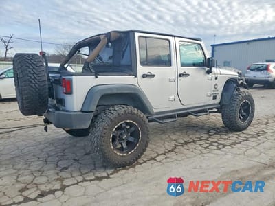 Trzecie zdjęcie samochodu z tyłu: 2010 JEEP WRANGLER UNLIMITED SPORT VIN:1J4BA3H10AL108004 - miniatura