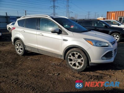 Czwarte zdjęcie samochodu z boku: 2014 FORD ESCAPE TITANIUM VIN:1FMCU0JX4EUD43208 - miniatura