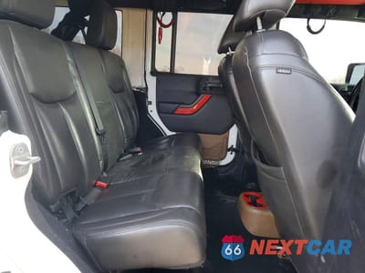 Zdjęcie 11 z 12 samochodu: 2014 JEEP WRANGLER UNLIMITED SAHARA VIN:1C4HJWEGXEL262428 - miniatura