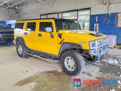 Czwarte zdjęcie samochodu z boku: 2005 HUMMER H2 VIN:5GRGN23U75H132545 - miniatura