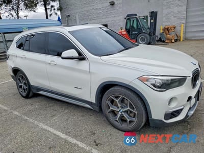 Czwarte zdjęcie samochodu z boku: 2017 BMW X1 XDRIVE28I VIN:WBXHT3C30H5F69002 - miniatura