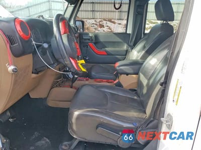 Zdjęcie 7 z 12 samochodu: 2014 JEEP WRANGLER UNLIMITED SAHARA VIN:1C4HJWEGXEL262428 - miniatura