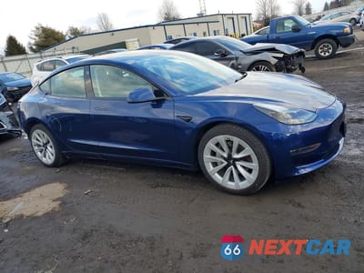 Czwarte zdjęcie samochodu z boku: 2022 TESLA MODEL 3 VIN:5YJ3E1EB2NF254414 - miniatura