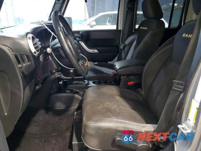 Zdjęcie 7 z 12 samochodu: 2013 JEEP WRANGLER UNLIMITED SAHARA VIN:1C4BJWEG0DL560796 - miniatura