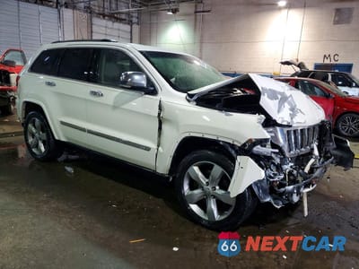Czwarte zdjęcie samochodu z boku: 2011 JEEP GRAND CHEROKEE OVERLAND VIN:1J4RR6GT7BC535970 - miniatura