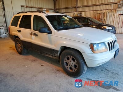 Czwarte zdjęcie samochodu z boku: 1999 JEEP GRAND CHEROKEE LAREDO VIN:1J4GW58S6XC508704 - miniatura