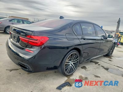 Trzecie zdjęcie samochodu z tyłu: 2018 BMW 750 XI VIN:WBA7F2C59JG424458 - miniatura