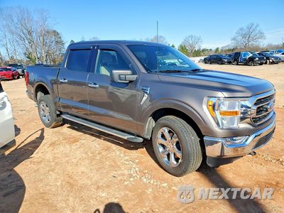 Czwarte zdjęcie samochodu z boku: 2022 FORD F150 XLT VIN:1FTFW1E54NFA41593 - miniatura