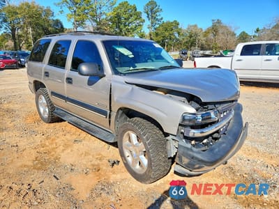 Czwarte zdjęcie samochodu z boku: 2001 CHEVROLET TAHOE C1500 VIN:1GNEC13T11J191651 - miniatura