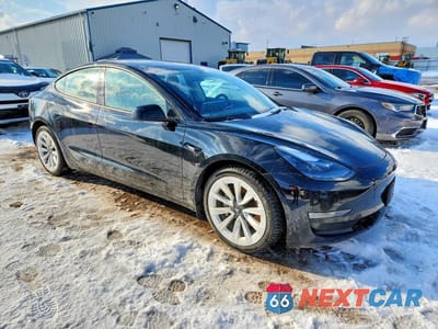 Czwarte zdjęcie samochodu z boku: 2022 TESLA MODEL 3 VIN:5YJ3E1EBXNF320269 - miniatura